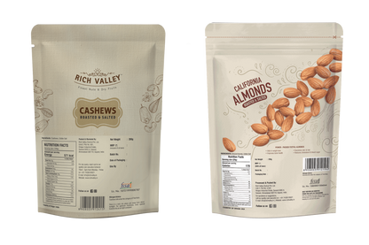 Two packages of Rich Valley cashews and California almonds on a white background