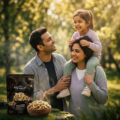 Family outdoors with Rich Valley cashew products displayed in a natural setting