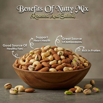 Roasted salted nutty mix in wooden bowl on gray background